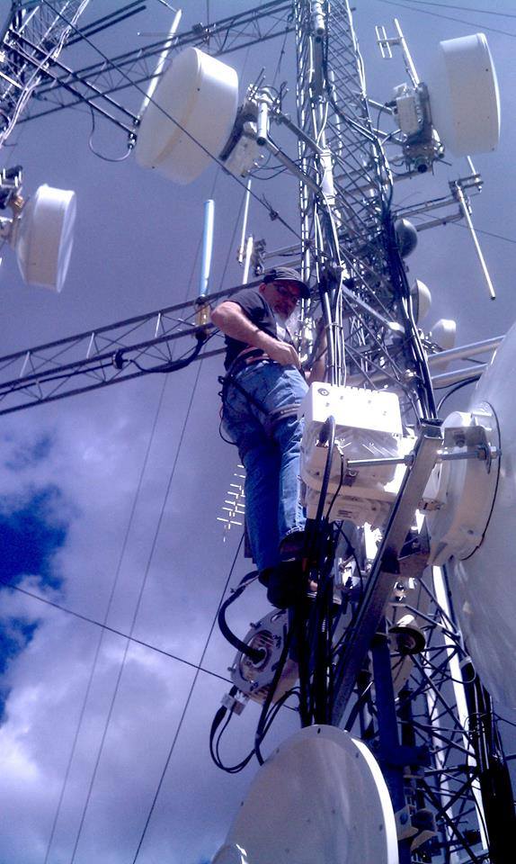 Eric Funk climbing KRKQ radio tower